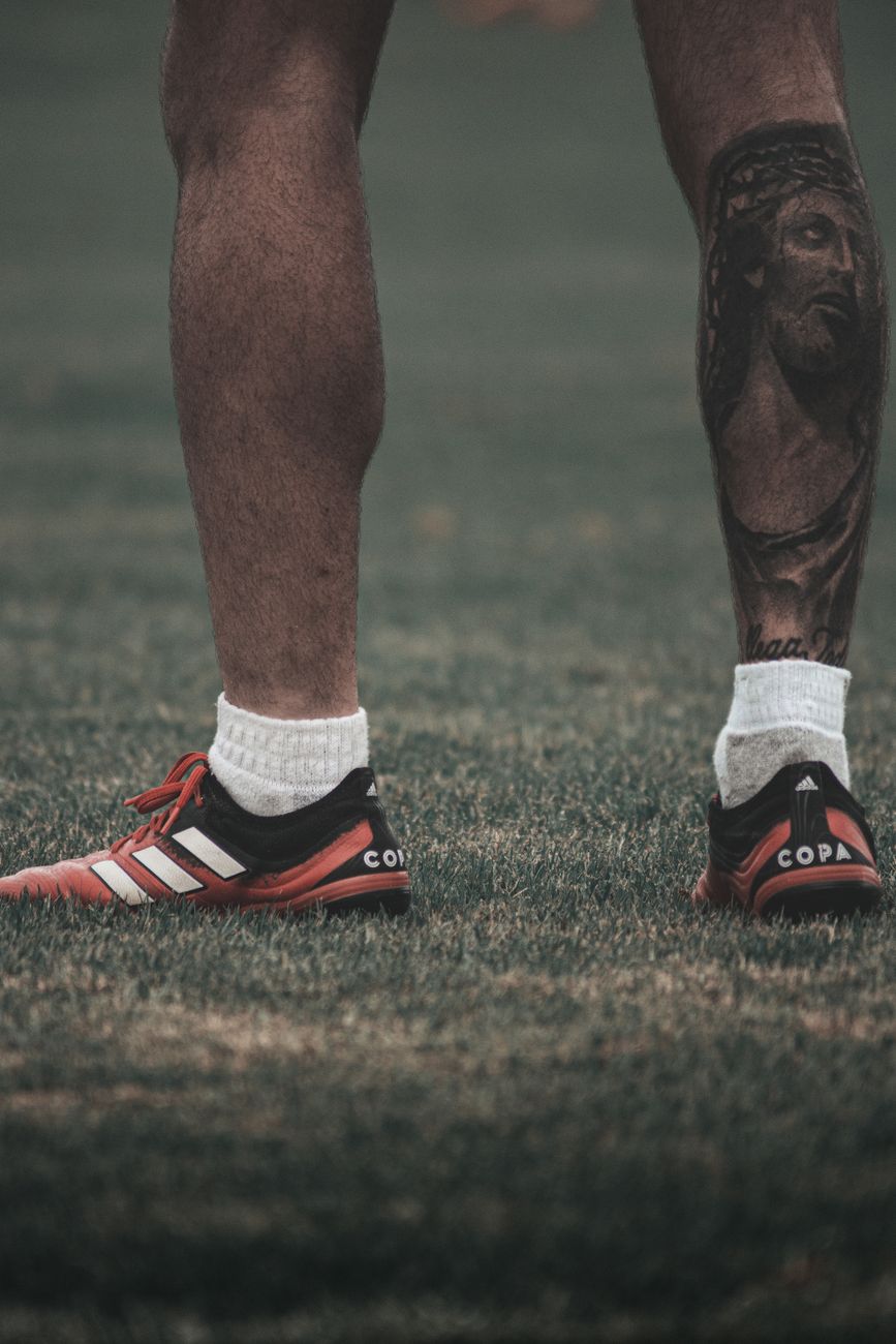 a close up shot of a tattooed man