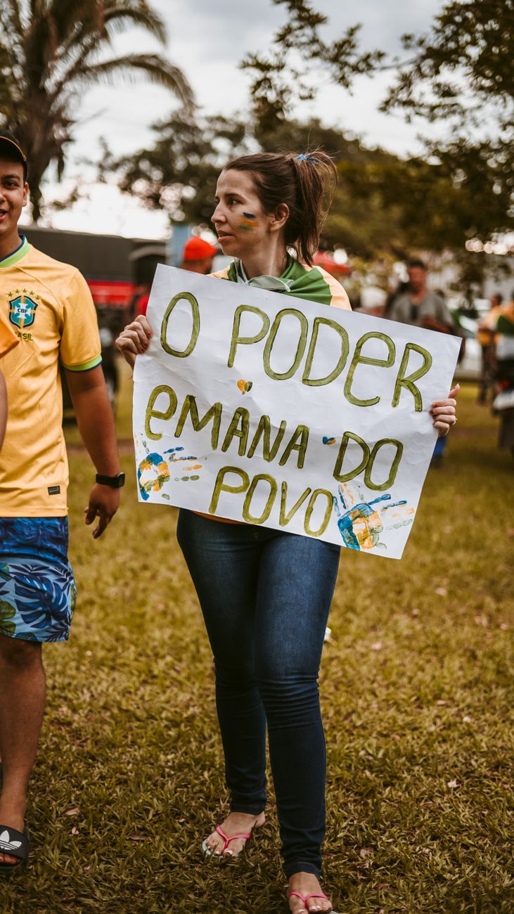 a woman holding a poster