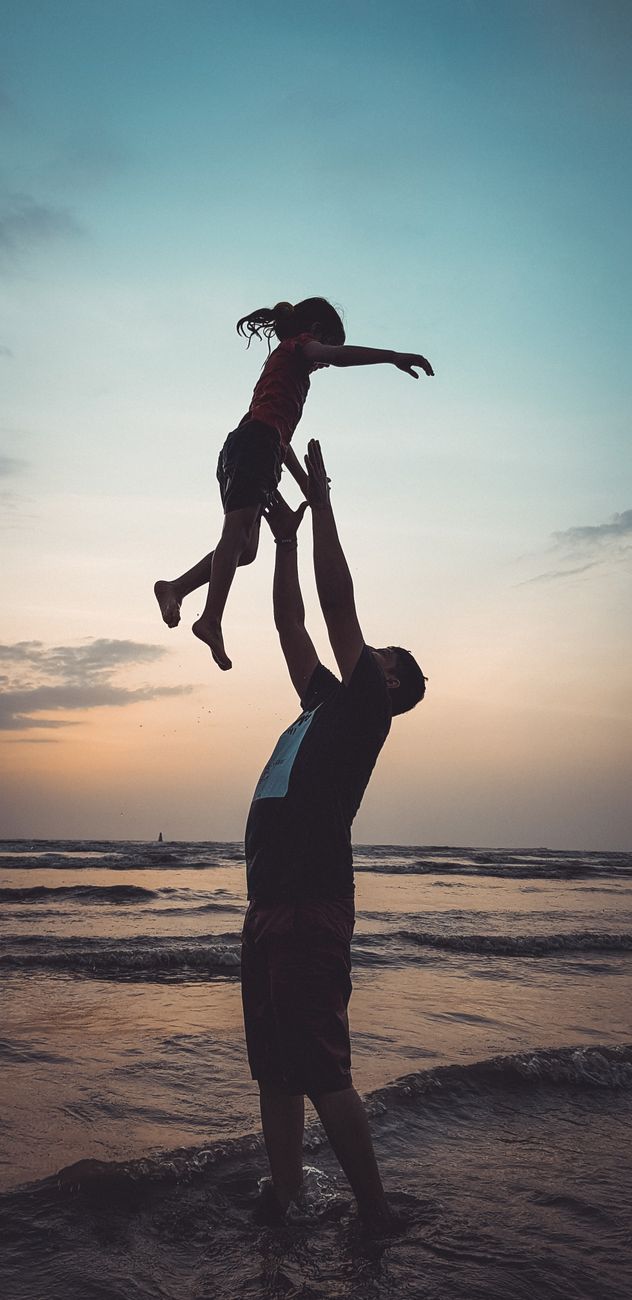 father playing with his daughter